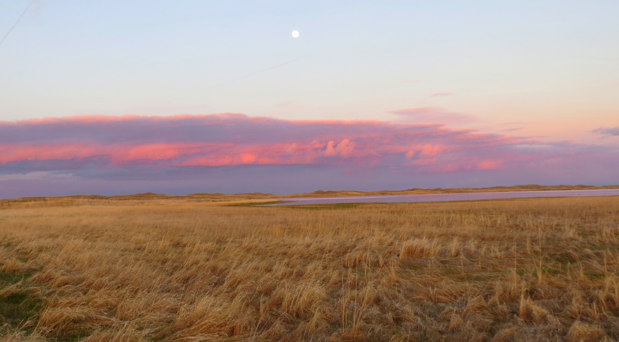 Sandhills lake in Morrill County at dusk (with a full moon). 