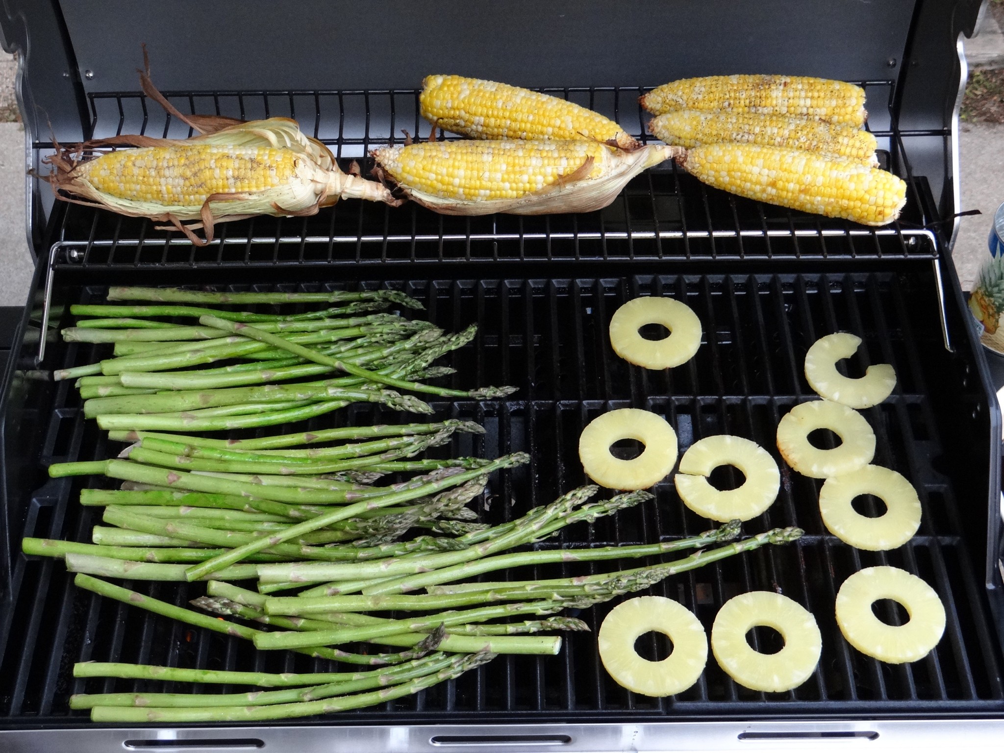 Grilling various fruits and vegetables. Photo by Greg Wagner.