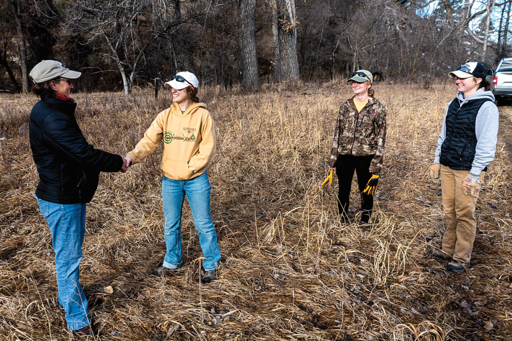 prospective hunters shake hands with landowners after asking for permission to hunt on their lands.