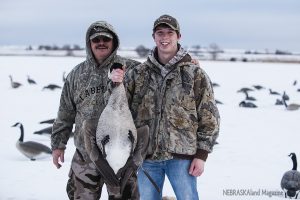 Sawyer Haag with first goose and Larry Olson