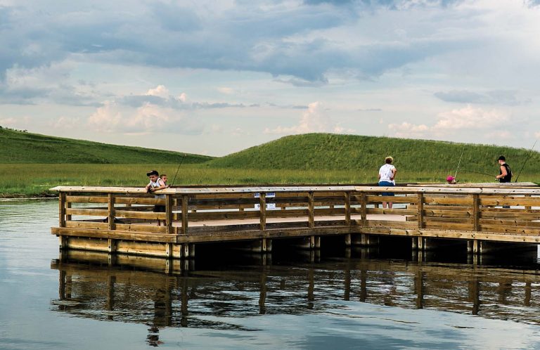 People fishing on a dock.