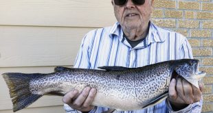 Walton Moore of North Platte with the record tiger trout he caught at Sutherland Reservoir inlet March 11.