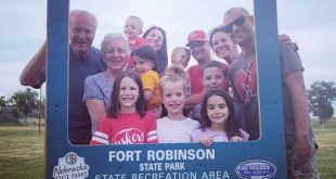 Family posing in the Fort Robinson photo frame.