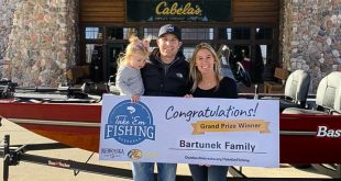 Mitch and Heather Bartunek introduced their 2-year-old daughter, Tinley, to fishing this year. Now that they have won the grand prize in the 2021 Take ’em Fishing program, they can take her fishing next year in their new Bass Tracker Classic XL fishing boat courtesy of Bass Pro Shops and Cabela’s. (Nebraska Game and Parks Commission)