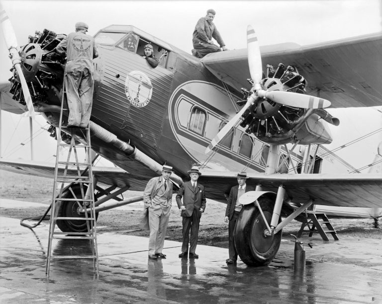 Six men pose with a Boeing 80A at Omaha Municipal Airport, June 5, 1930.