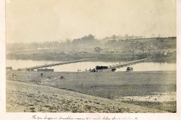 A vintage photo of a bridge over a river