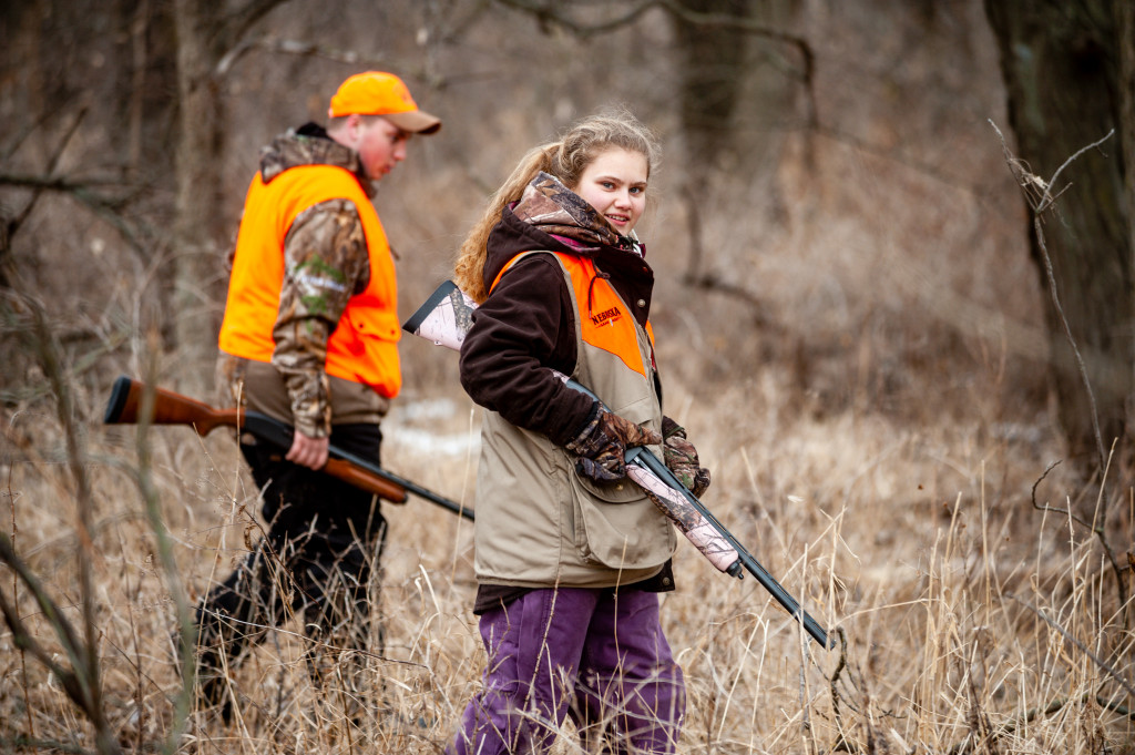 A girl goes hunting with a mentor.