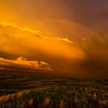 storm photography golden hour rainbow