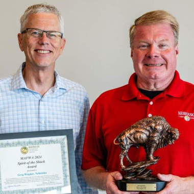 Nebraska Game and Parks Commission Director Tim McCoy presenting the Midwest Fish & Wildlife Agencies’ Spirit of the Shack Achievement Award to Greg Wagner.