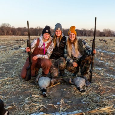 Three women Canada goose hunting.