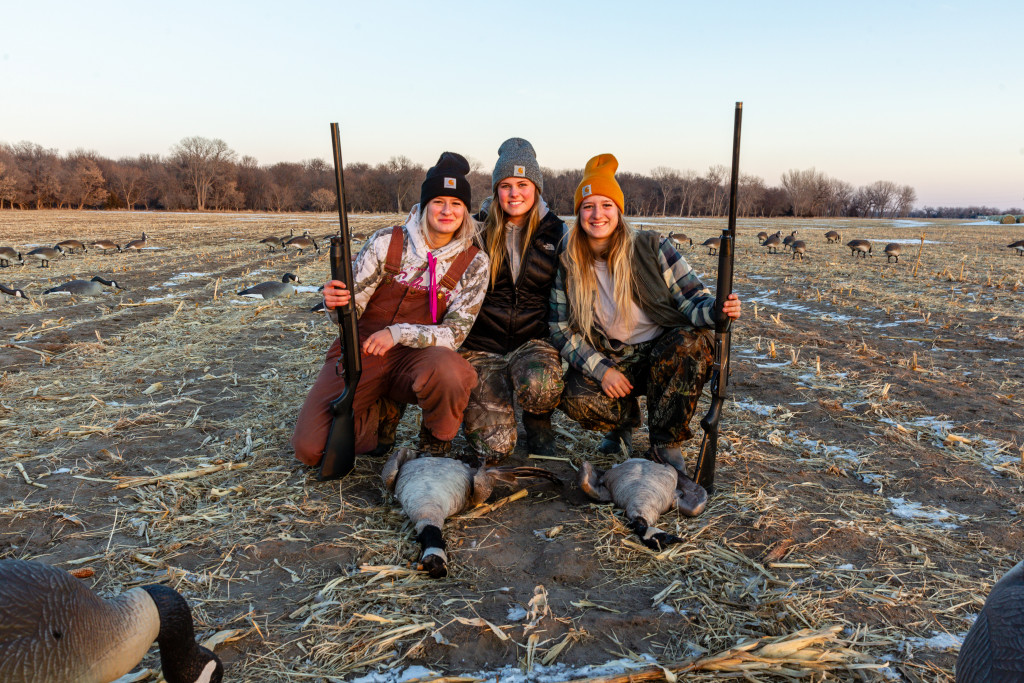 Three women Canada goose hunting.