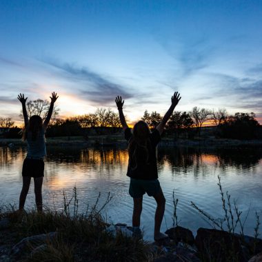 Two girls on the edge of the water at Rock Creek SRA.