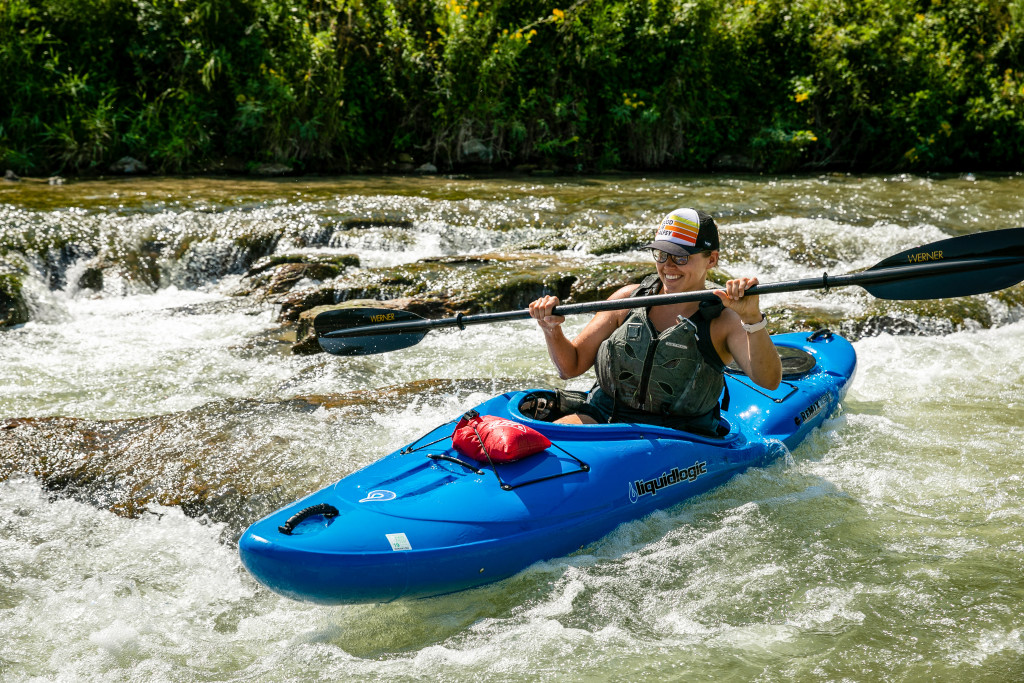 A woman kayaks down a shoot on the Niobrara River.