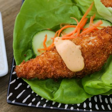 Perch fish fillet coated in panko breadcrumbs and fried, served in a lettuce wrap with spicy mayo.