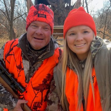 A man and his daughter deer hunting in a forest in Nebraska in November.