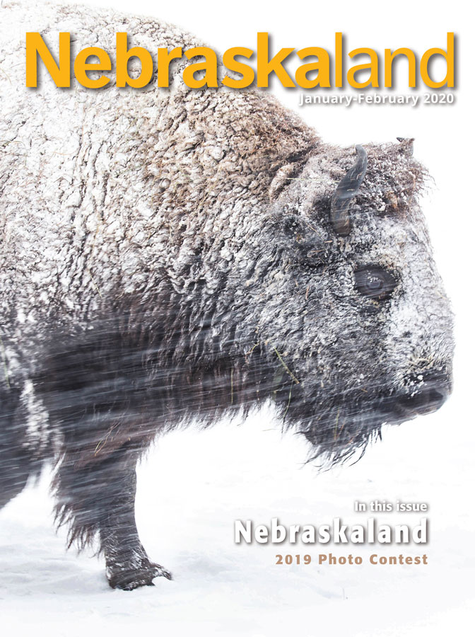 January-February cover of Nebraskaland featuring the 2019 photo contest winner's photo of a bison walking through a blizzard.