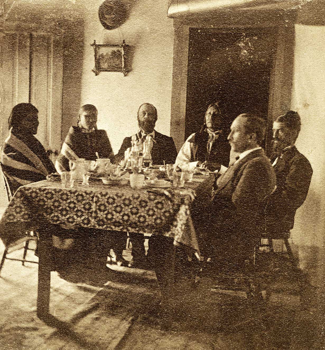 Spotted Tail, an important Brule Lakota chief (third from right) at breakfast in the home of Maj. J.W. Paddock at Camp Robinson in 1877.