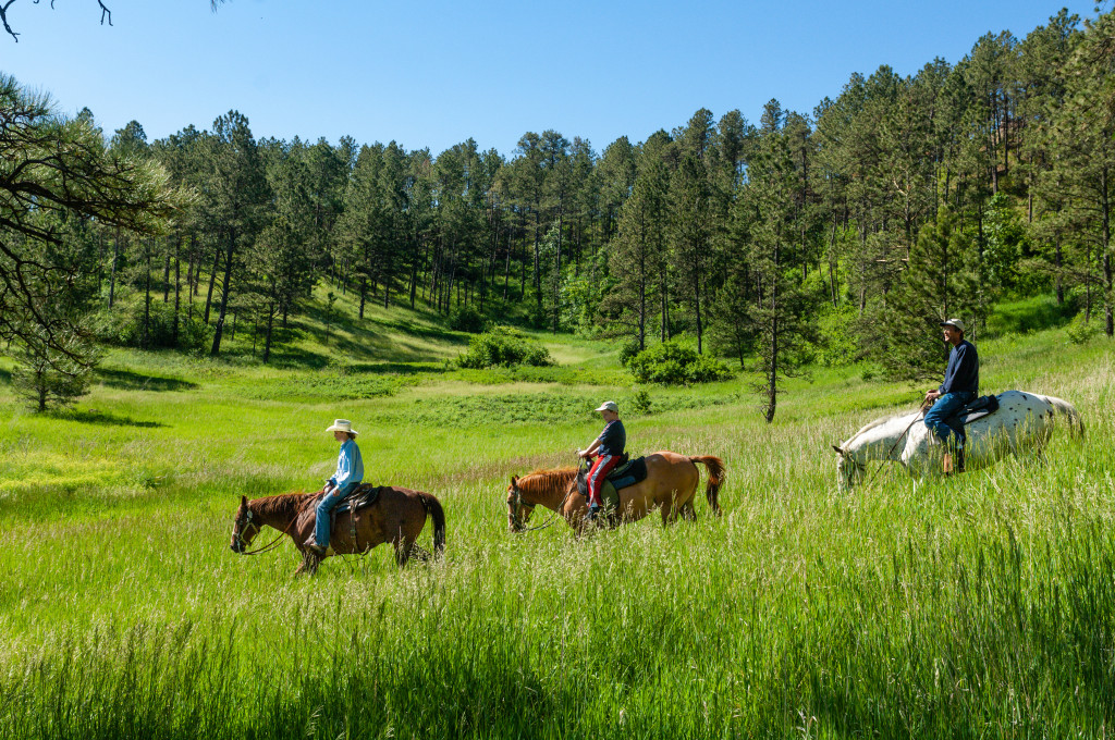 People riding horses at Chadron State Park.