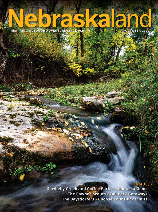 October 2023 Nebraskaland Magazine cover featuring a flowing stream at Sowbelly Creek.