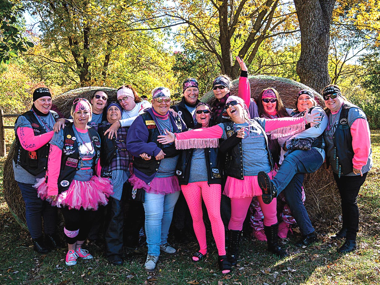 Members of a female motorcycling organization wearing pink.