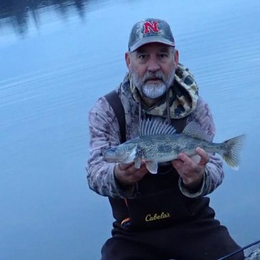 Angler holding a saugeye.