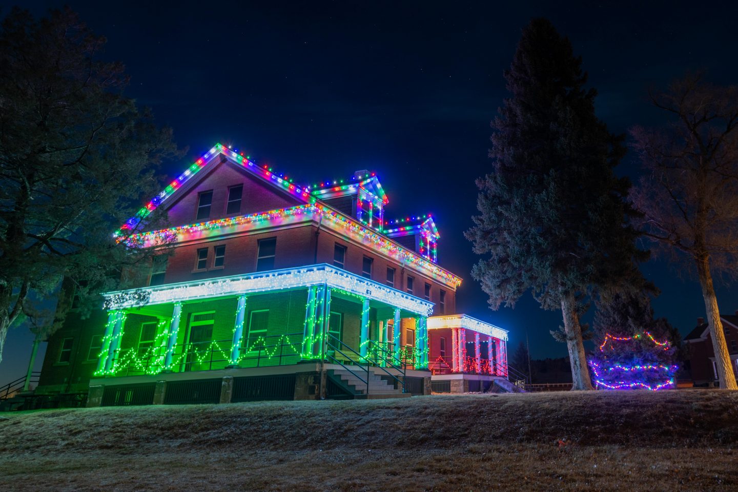 Holidays lights at one of Fort Robinson State Park’s historical buildings. While we have limited data on effects of lighting during nighttime, what we do know about light emissions and skyglow—the brightening of the night sky that makes it harder to see stars—suggests that the skies are indeed brighter during the holiday season. 