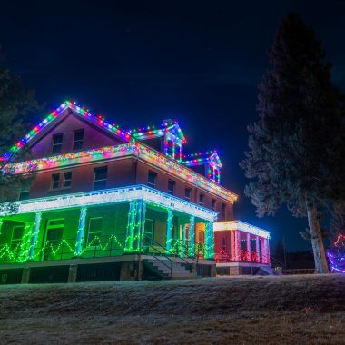 Holidays lights at one of Fort Robinson State Park’s historical buildings. While we have limited data on effects of lighting during nighttime, what we do know about light emissions and skyglow—the brightening of the night sky that makes it harder to see stars—suggests that the skies are indeed brighter during the holiday season.