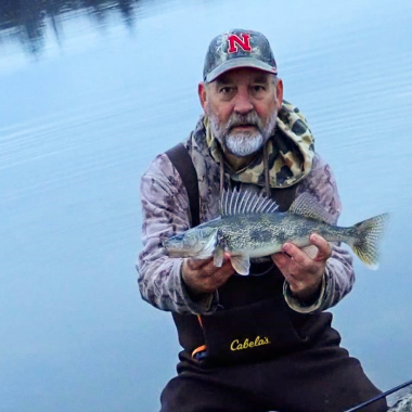 Angler holding a saugeye.