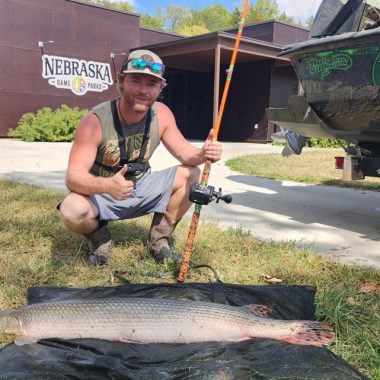 Angler with longnose gar.