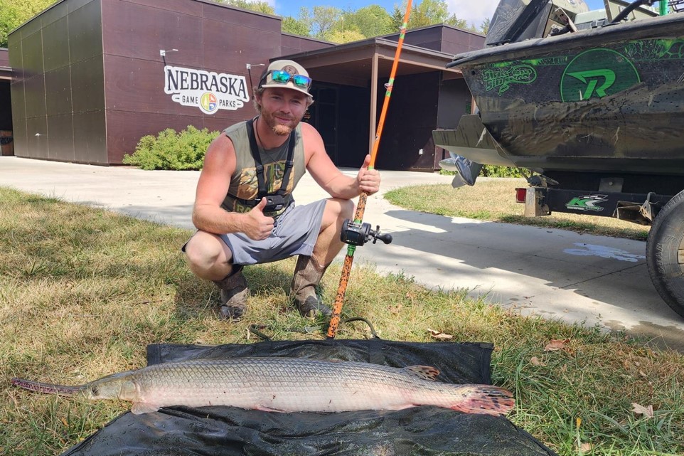 Angler with longnose gar.