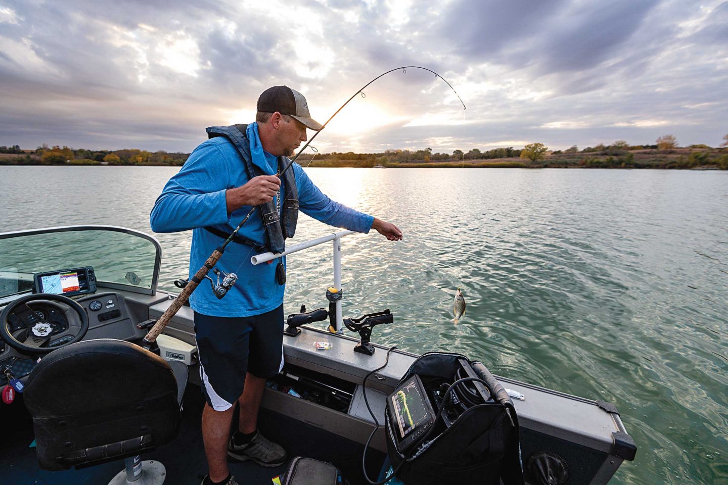 A man fishing for crappie from a boat with forward-facing sonar.