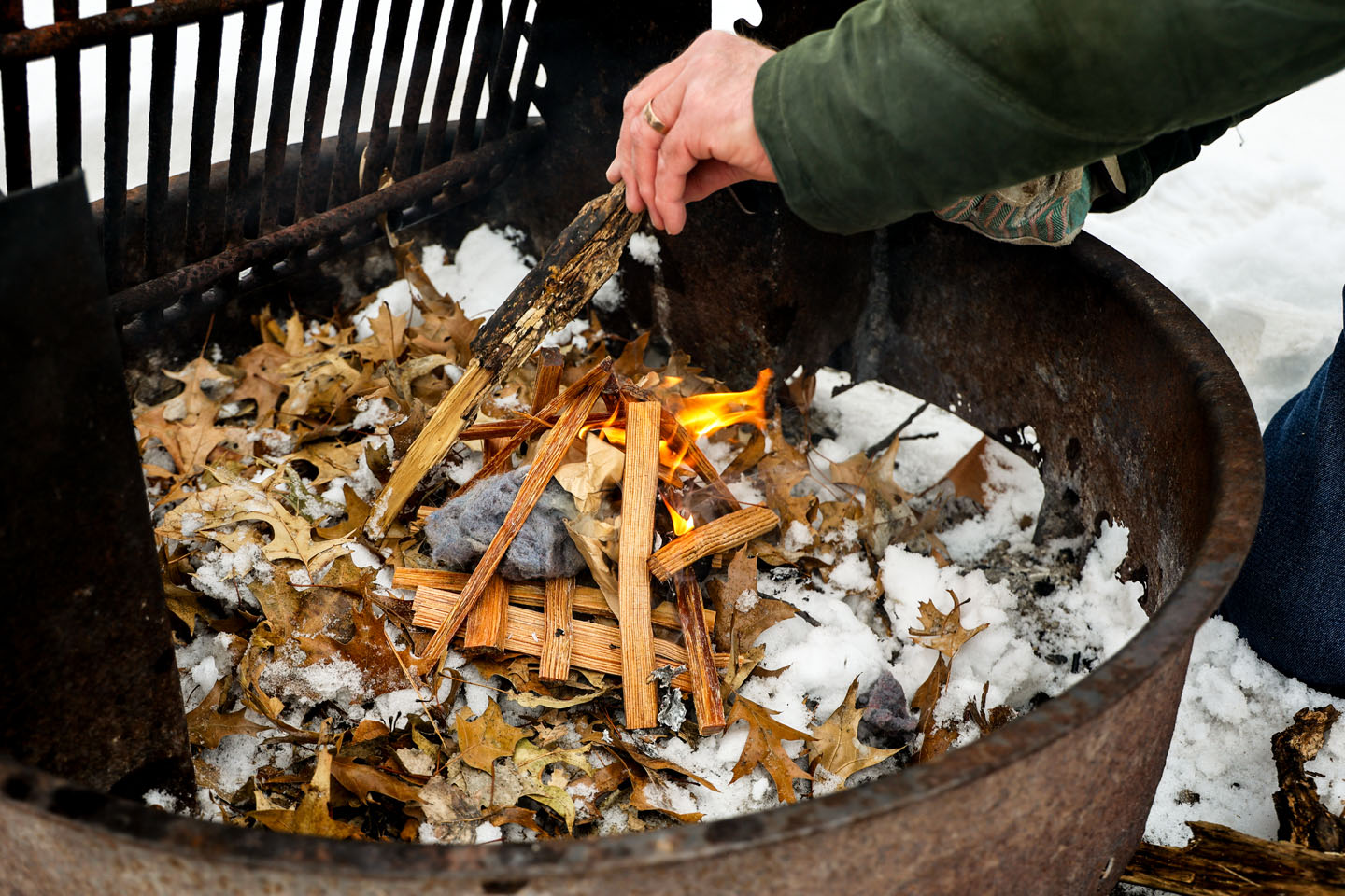 Tinder and kindling for starting a fire in a campfire ring.