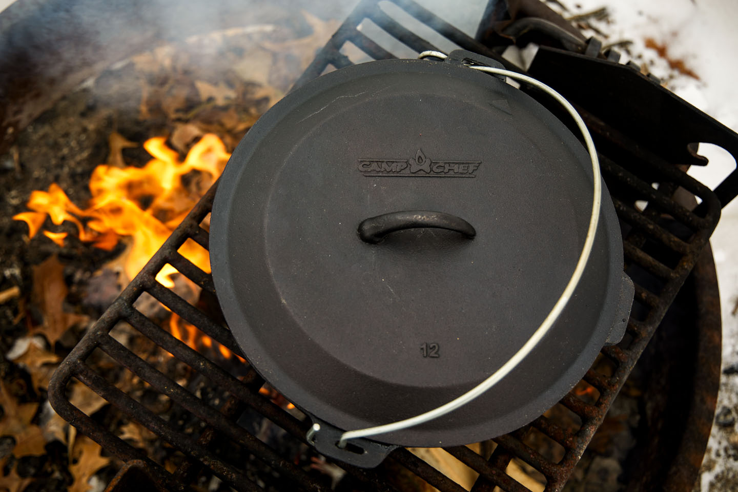 Cast iron pot over a campfire.