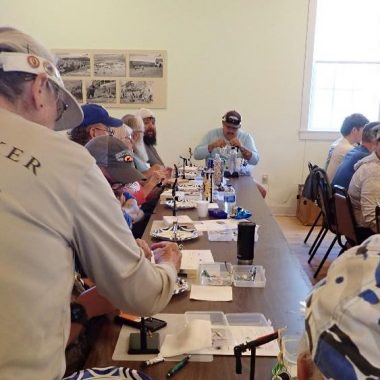 Students and instructors at fly-tying class.