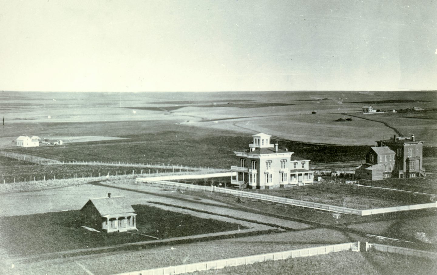 The Thomas P. Kennard house (with cupola) in 1872. Located on H Street just west of 17th Street in Lincoln, the house is owned by the Nebraska State Historical Society. The view is to the southeast from the capitol. NSHS RG2432-1-337