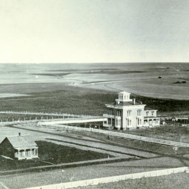 The Thomas P. Kennard house (with cupola) in 1872. Located on H Street just west of 17th Street in Lincoln, the house is owned by the Nebraska State Historical Society. The view is to the southeast from the capitol. NSHS RG2432-1-337