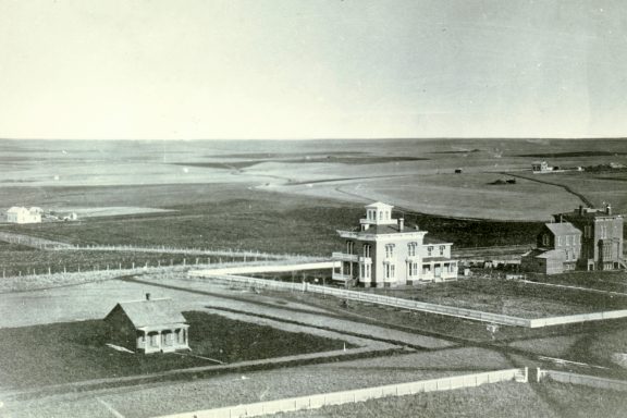 The Thomas P. Kennard house (with cupola) in 1872. Located on H Street just west of 17th Street in Lincoln, the house is owned by the Nebraska State Historical Society. The view is to the southeast from the capitol. NSHS RG2432-1-337