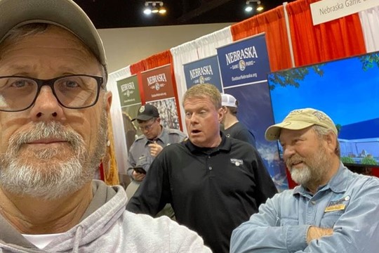 Personnel in booth at Omaha Sport Show.