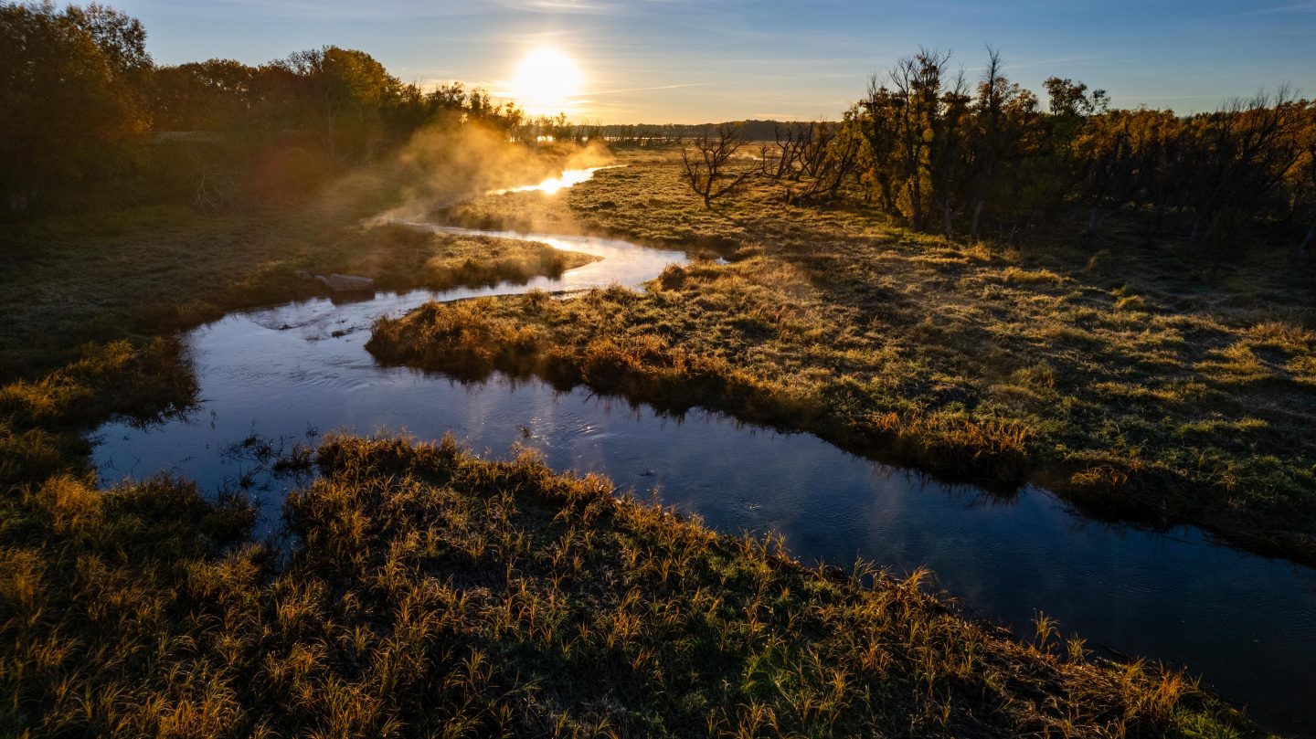 Sunrise over a creek. 