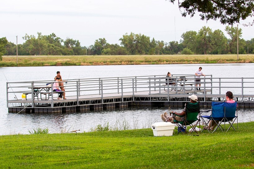 Anglers fishing from shore and dock.