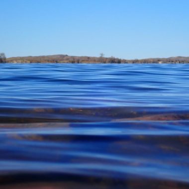 Lake panorama from the water's surface.