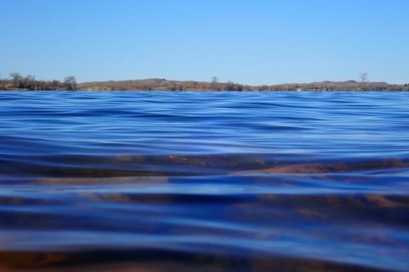 Lake panorama from the water's surface.