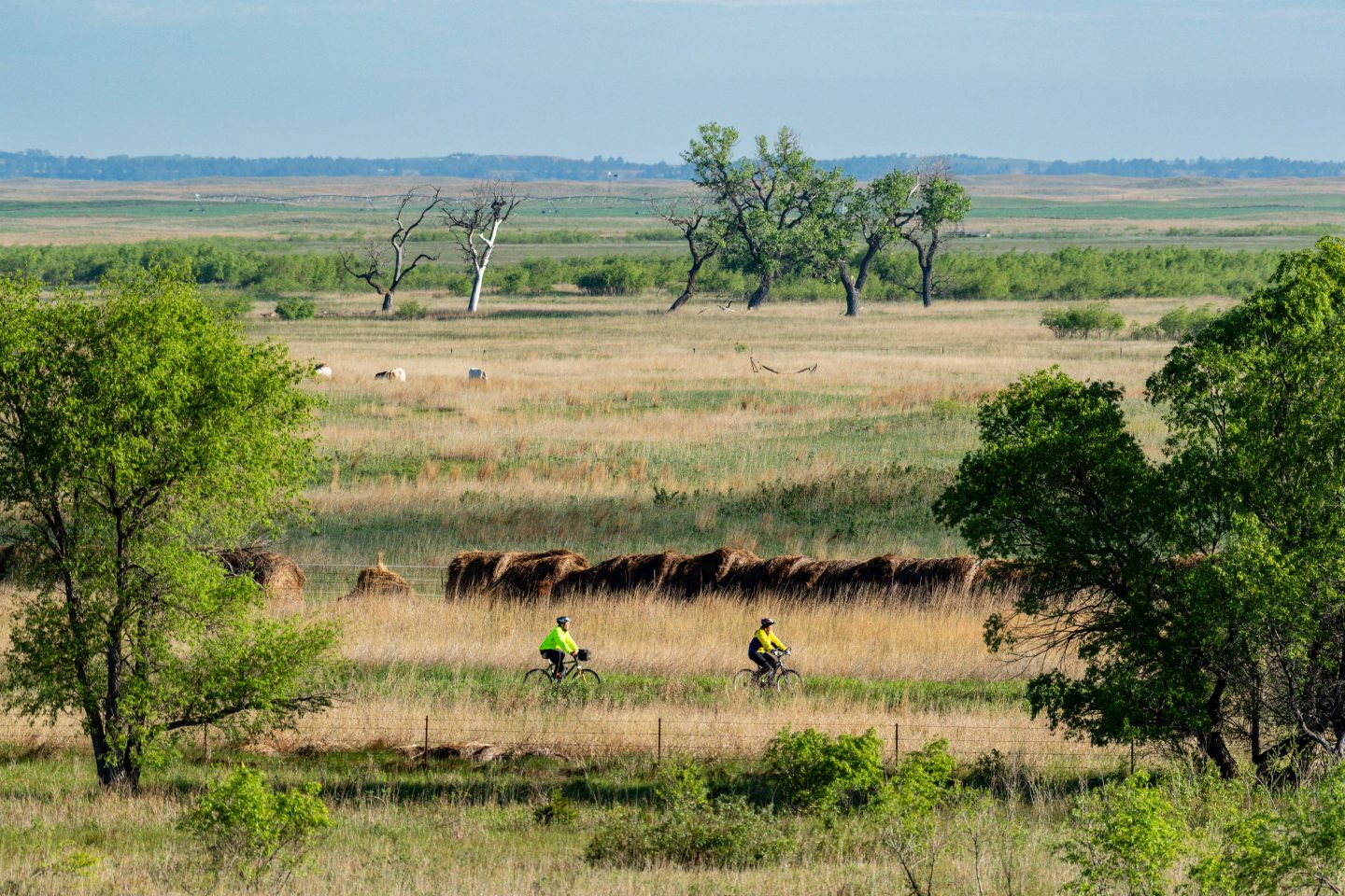 A couple bicycling on the Cowboy Trail in the Sandhills.