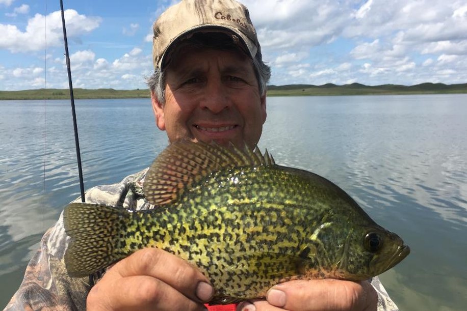 Angler with black crappie.