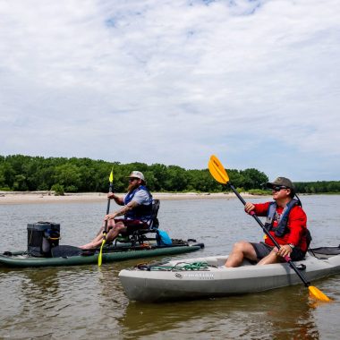 Two men kayaking on the Loup River Water Trail.