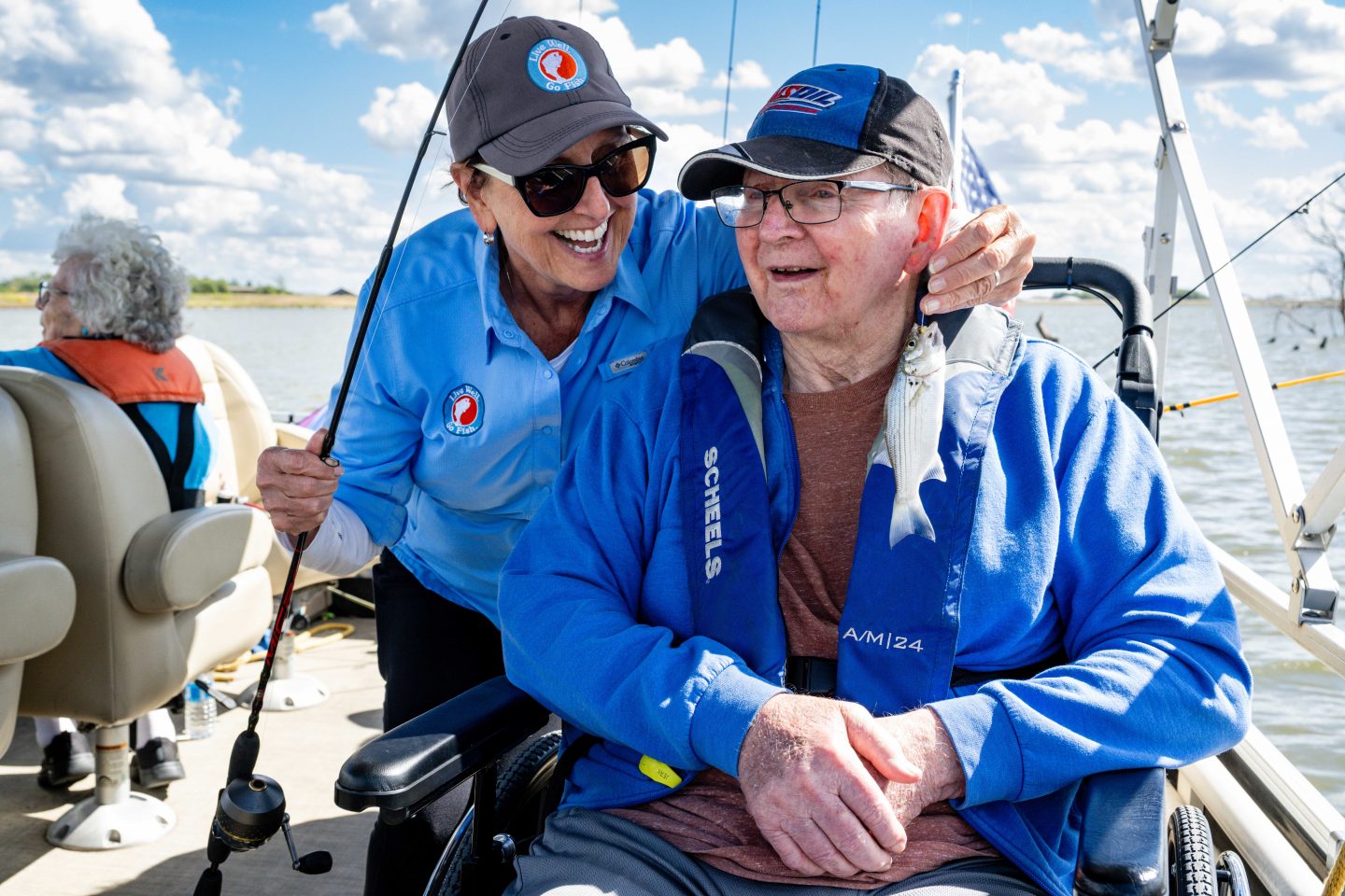 Volunteer Robin Taylor and Dennis Jeppson, a resident at Saunders Medical Center, are all smiles after Jeppson landed a small wiper.