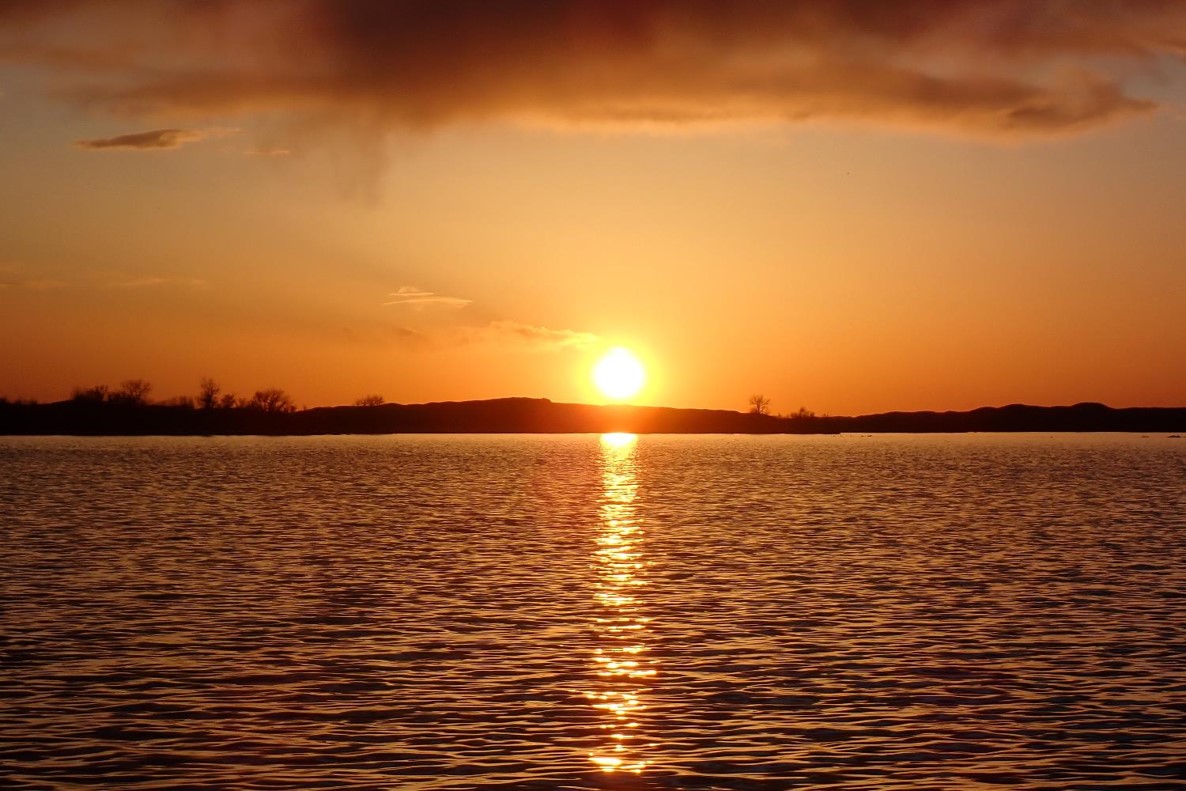Sunset reflecting off lake.