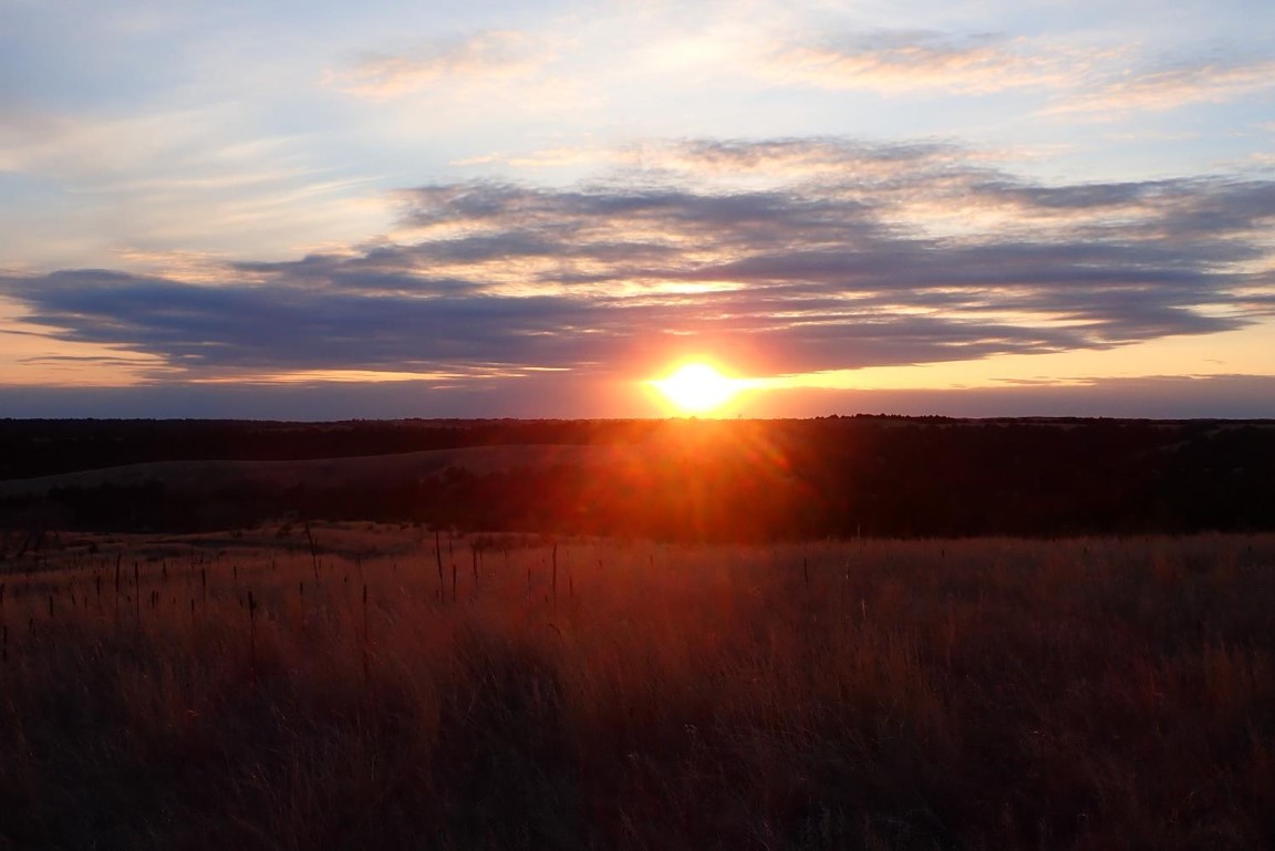 Sunset over southwest Nebraska canyons.