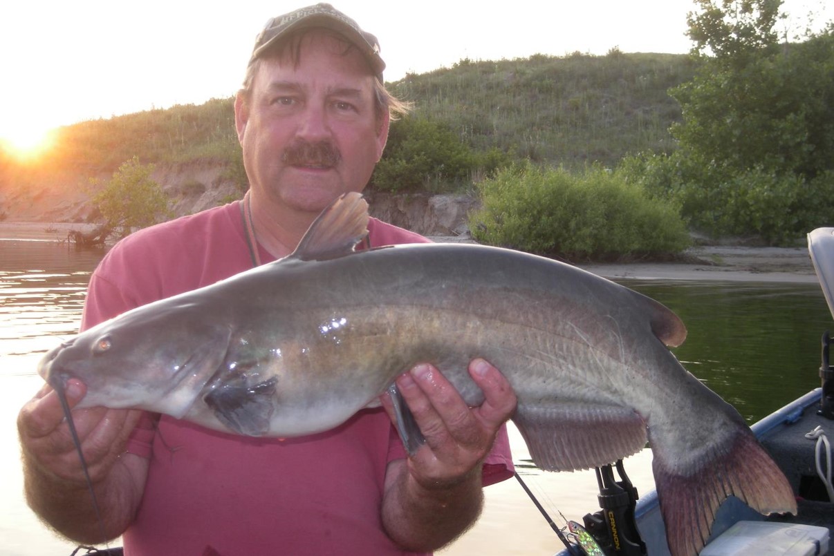 Angler holding a channel catfish.
