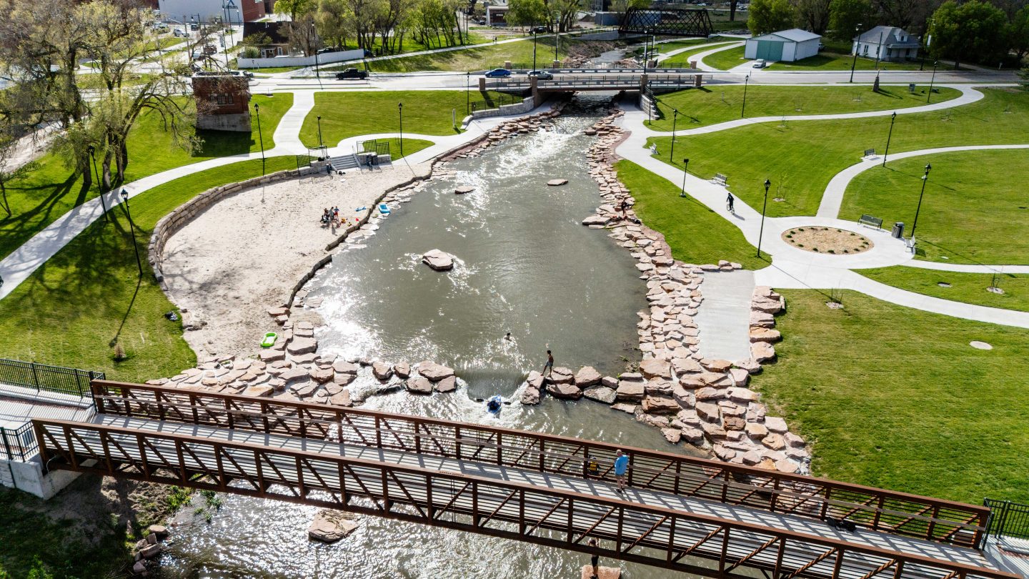 People kayak, swim and relax around the North Fork Whitewater Park in Johnson Park, located blocks from downtown Norfolk.